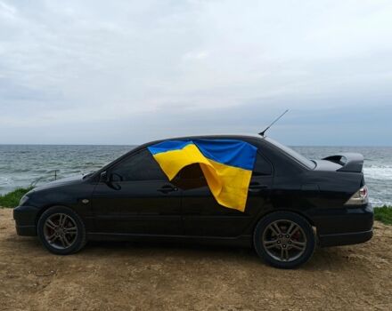 Чорний Міцубісі Lancer, об'ємом двигуна 2 л та пробігом 270 тис. км за 5000 $, фото 4 на Automoto.ua