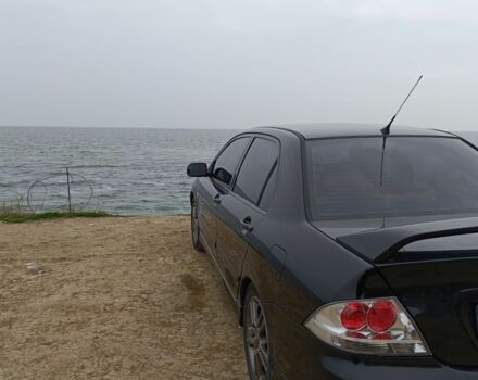 Чорний Міцубісі Lancer, об'ємом двигуна 2 л та пробігом 270 тис. км за 5000 $, фото 3 на Automoto.ua