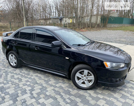 Чорний Міцубісі Lancer, об'ємом двигуна 2 л та пробігом 170 тис. км за 6999 $, фото 9 на Automoto.ua