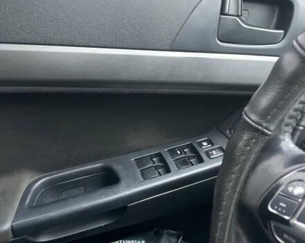 Черный Мицубиси Лансер, объемом двигателя 2 л и пробегом 260 тыс. км за 6000 $, фото 1 на Automoto.ua