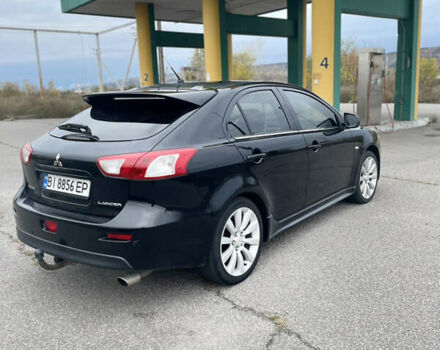 Черный Мицубиси Лансер, объемом двигателя 1.97 л и пробегом 300 тыс. км за 6800 $, фото 1 на Automoto.ua
