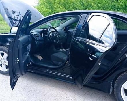 Чорний Міцубісі Lancer, об'ємом двигуна 2 л та пробігом 49 тис. км за 12500 $, фото 3 на Automoto.ua