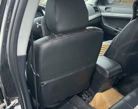 Черный Мицубиси Лансер, объемом двигателя 2 л и пробегом 260 тыс. км за 6000 $, фото 11 на Automoto.ua