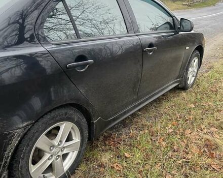 Черный Мицубиси Лансер, объемом двигателя 2 л и пробегом 260 тыс. км за 6000 $, фото 4 на Automoto.ua