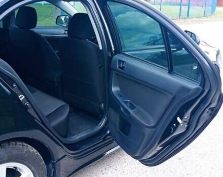 Чорний Міцубісі Lancer, об'ємом двигуна 2 л та пробігом 49 тис. км за 12500 $, фото 28 на Automoto.ua