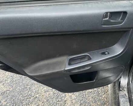 Черный Мицубиси Лансер, объемом двигателя 2 л и пробегом 260 тыс. км за 6000 $, фото 2 на Automoto.ua