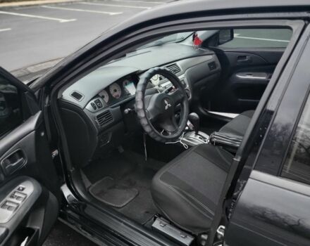 Черный Мицубиси Лансер, объемом двигателя 1.6 л и пробегом 170 тыс. км за 5000 $, фото 3 на Automoto.ua