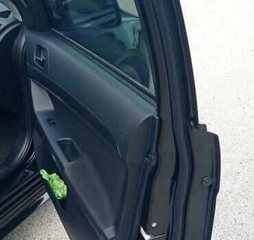 Чорний Міцубісі Lancer, об'ємом двигуна 2 л та пробігом 49 тис. км за 12500 $, фото 23 на Automoto.ua