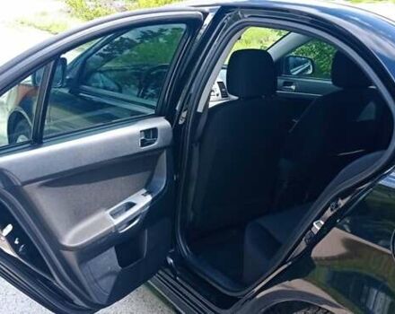 Чорний Міцубісі Lancer, об'ємом двигуна 2 л та пробігом 49 тис. км за 12500 $, фото 39 на Automoto.ua