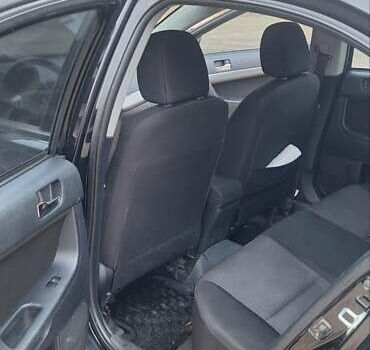 Чорний Міцубісі Lancer, об'ємом двигуна 1.8 л та пробігом 213 тис. км за 6200 $, фото 9 на Automoto.ua