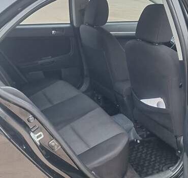 Чорний Міцубісі Lancer, об'ємом двигуна 1.8 л та пробігом 213 тис. км за 6200 $, фото 10 на Automoto.ua
