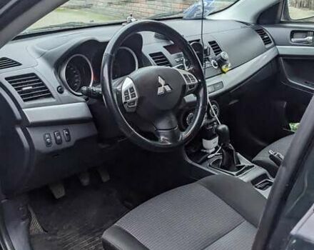 Черный Мицубиси Лансер, объемом двигателя 1.8 л и пробегом 210 тыс. км за 7300 $, фото 1 на Automoto.ua