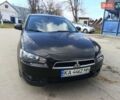 Черный Мицубиси Лансер, объемом двигателя 2 л и пробегом 279 тыс. км за 6200 $, фото 1 на Automoto.ua