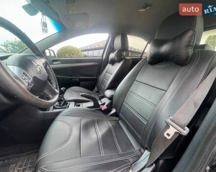 Чорний Міцубісі Lancer, об'ємом двигуна 1.8 л та пробігом 263 тис. км за 6999 $, фото 23 на Automoto.ua