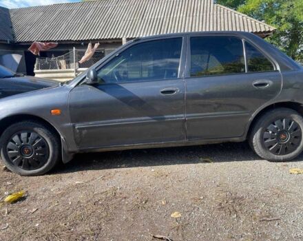 Чорний Міцубісі Lancer, об'ємом двигуна 1.3 л та пробігом 350 тис. км за 2300 $, фото 3 на Automoto.ua
