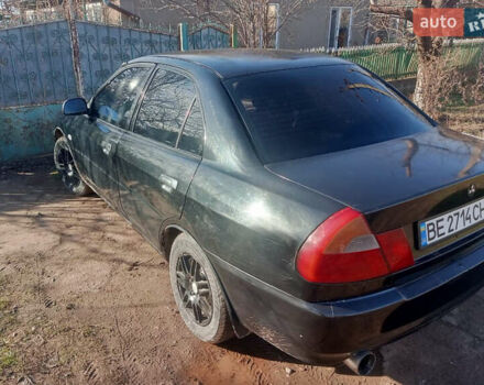 Чорний Міцубісі Lancer, об'ємом двигуна 1.3 л та пробігом 300 тис. км за 2000 $, фото 4 на Automoto.ua