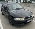 Черный Мицубиси Лансер, объемом двигателя 1.3 л и пробегом 160 тыс. км за 1606 $, фото 1 на Automoto.ua