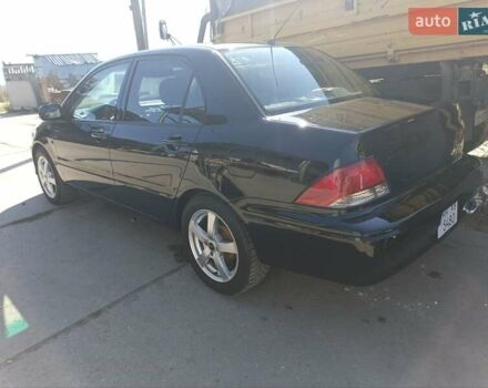 Черный Мицубиси Лансер, объемом двигателя 2 л и пробегом 270 тыс. км за 3800 $, фото 6 на Automoto.ua