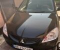 Чорний Міцубісі Lancer, об'ємом двигуна 2 л та пробігом 270 тис. км за 5000 $, фото 1 на Automoto.ua