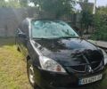 Чорний Міцубісі Lancer, об'ємом двигуна 1.58 л та пробігом 349 тис. км за 2000 $, фото 1 на Automoto.ua
