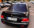 Черный Мицубиси Лансер, объемом двигателя 1.58 л и пробегом 315 тыс. км за 2600 $, фото 1 на Automoto.ua