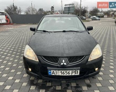 Чорний Міцубісі Lancer, об'ємом двигуна 1.58 л та пробігом 290 тис. км за 3900 $, фото 5 на Automoto.ua