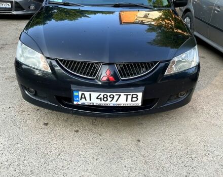 Черный Мицубиси Лансер, объемом двигателя 1.6 л и пробегом 280 тыс. км за 3000 $, фото 2 на Automoto.ua