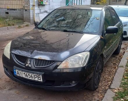 Черный Мицубиси Лансер, объемом двигателя 1.6 л и пробегом 218 тыс. км за 3200 $, фото 1 на Automoto.ua