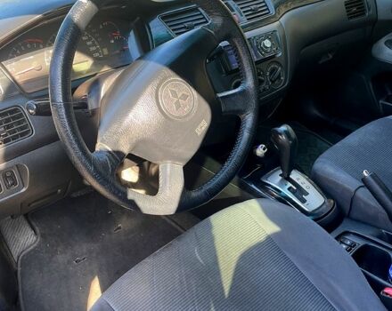 Черный Мицубиси Лансер, объемом двигателя 1.6 л и пробегом 280 тыс. км за 3000 $, фото 3 на Automoto.ua