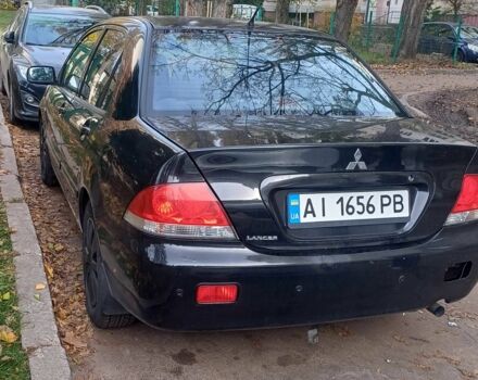 Черный Мицубиси Лансер, объемом двигателя 1.6 л и пробегом 218 тыс. км за 3200 $, фото 2 на Automoto.ua