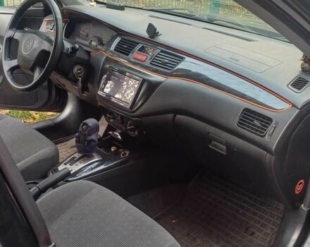 Черный Мицубиси Лансер, объемом двигателя 1.6 л и пробегом 218 тыс. км за 3200 $, фото 4 на Automoto.ua