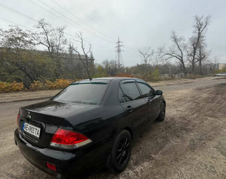 Черный Мицубиси Лансер, объемом двигателя 1.58 л и пробегом 229 тыс. км за 3700 $, фото 1 на Automoto.ua