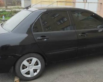 Черный Мицубиси Лансер, объемом двигателя 1.58 л и пробегом 240 тыс. км за 3700 $, фото 12 на Automoto.ua