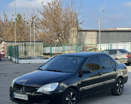 Мицубиси Лансер 2004 в Харькове на Automoto.ua Черный Мицубиси Лансер, объемом двигателя 1.58 л и пробегом 230 тыс. км за 2899 $, фото 2 на Automoto.ua