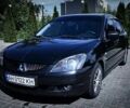 Черный Мицубиси Лансер, объемом двигателя 2 л и пробегом 290 тыс. км за 5550 $, фото 1 на Automoto.ua