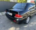 Мицубиси Лансер 2004 в Львове на Automoto.ua Черный Мицубиси Лансер, объемом двигателя 1.58 л и пробегом 463 тыс. км за 3900 $, фото 30 на Automoto.ua