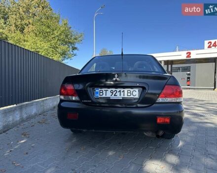 Мицубиси Лансер 2004 в Львове на Automoto.ua Черный Мицубиси Лансер, объемом двигателя 1.58 л и пробегом 463 тыс. км за 3900 $, фото 28 на Automoto.ua