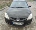 Чорний Міцубісі Lancer, об'ємом двигуна 1.58 л та пробігом 278 тис. км за 3700 $, фото 1 на Automoto.ua