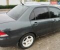 Черный Мицубиси Лансер, объемом двигателя 1.58 л и пробегом 265 тыс. км за 2600 $, фото 4 на Automoto.ua