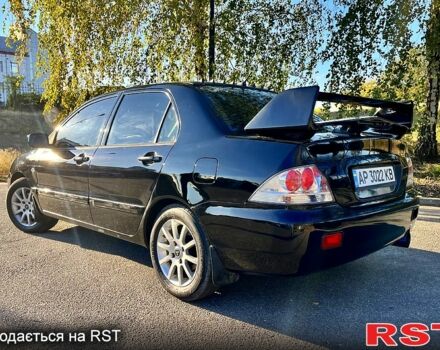 Черный Мицубиси Лансер, объемом двигателя 1.6 л и пробегом 300 тыс. км за 3650 $, фото 3 на Automoto.ua