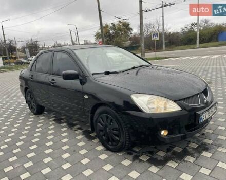 Чорний Міцубісі Lancer, об'ємом двигуна 1.58 л та пробігом 290 тис. км за 3900 $, фото 19 на Automoto.ua