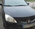 Черный Мицубиси Лансер, объемом двигателя 1.58 л и пробегом 240 тыс. км за 3700 $, фото 1 на Automoto.ua