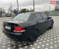 Чорний Міцубісі Lancer, об'ємом двигуна 1.58 л та пробігом 290 тис. км за 3900 $, фото 12 на Automoto.ua