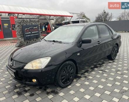 Чорний Міцубісі Lancer, об'ємом двигуна 1.58 л та пробігом 290 тис. км за 3900 $, фото 1 на Automoto.ua