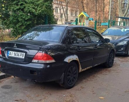 Черный Мицубиси Лансер, объемом двигателя 1.6 л и пробегом 218 тыс. км за 3200 $, фото 3 на Automoto.ua