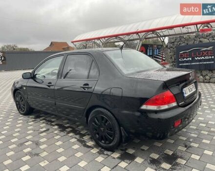 Чорний Міцубісі Lancer, об'ємом двигуна 1.58 л та пробігом 290 тис. км за 3900 $, фото 15 на Automoto.ua