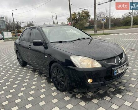 Чорний Міцубісі Lancer, об'ємом двигуна 1.58 л та пробігом 290 тис. км за 3900 $, фото 18 на Automoto.ua