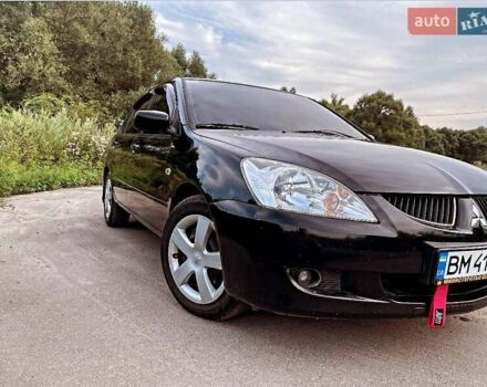 Черный Мицубиси Лансер, объемом двигателя 1.58 л и пробегом 172 тыс. км за 5700 $, фото 1 на Automoto.ua