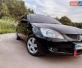 Черный Мицубиси Лансер, объемом двигателя 1.58 л и пробегом 172 тыс. км за 5700 $, фото 1 на Automoto.ua
