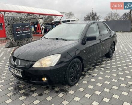 Чорний Міцубісі Lancer, об'ємом двигуна 1.58 л та пробігом 290 тис. км за 3900 $, фото 10 на Automoto.ua